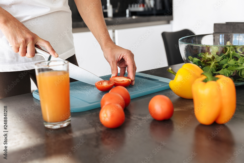 Attractive healthy woman cooking salad Attractive healthy woman cooking salad