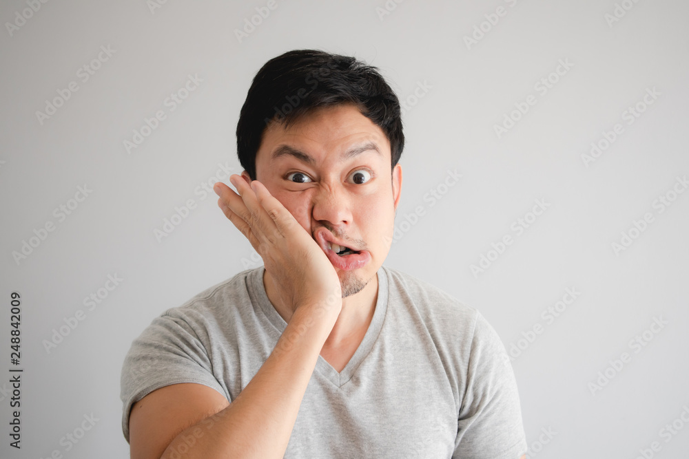 Funny face of angry man punish himself by hit on his own face. Funny face of angry man punish himself by hit on his own face.