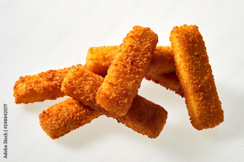 Heap of delicious deep fried crispy fish fingers sticks Heap of delicious deep fried crispy fish fingers sticks