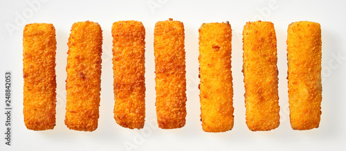 Photography Panorama banner of crumbed golden fish fingers sticks