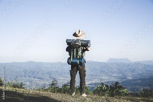 traveller male with backpack standing on the mountain. travel concept.
