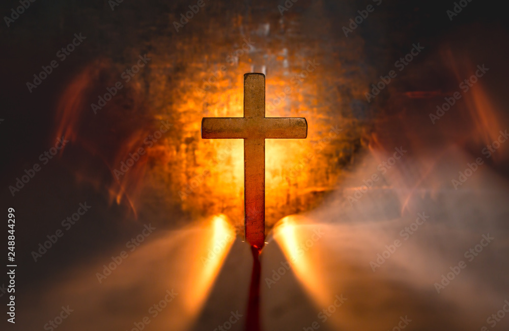 Cross with opening the Bible with light of candle. christian concept.
