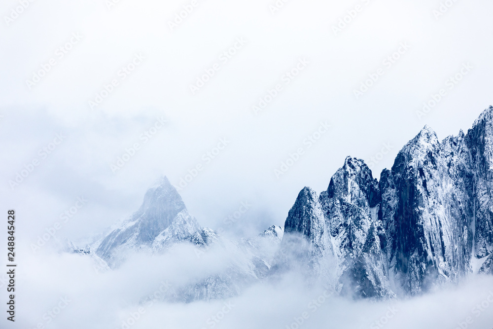 Snowy mountains in the clouds