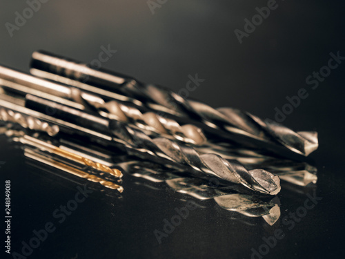 metal drill in assortment on a black background photo