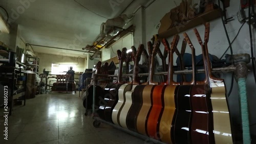 Luthier manufacturing a clasical guitar, close up.