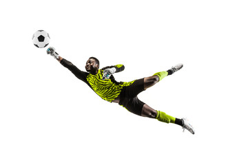 Male soccer player goalkeeper catching ball in jump. Silhouette of fit man with ball isolated on white studio background