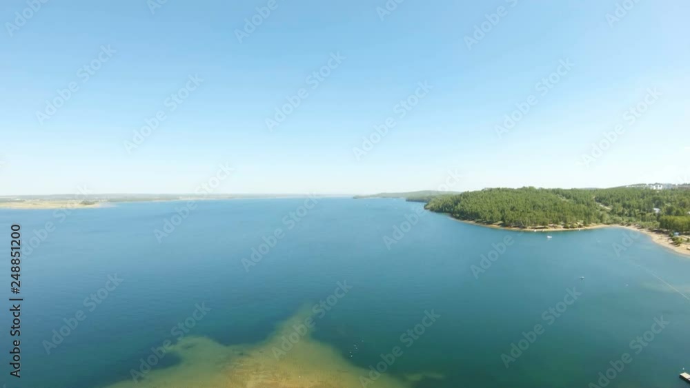 Aerial view of a river. Drone flies forward above water Aerial view of a river. Drone flies forward above water