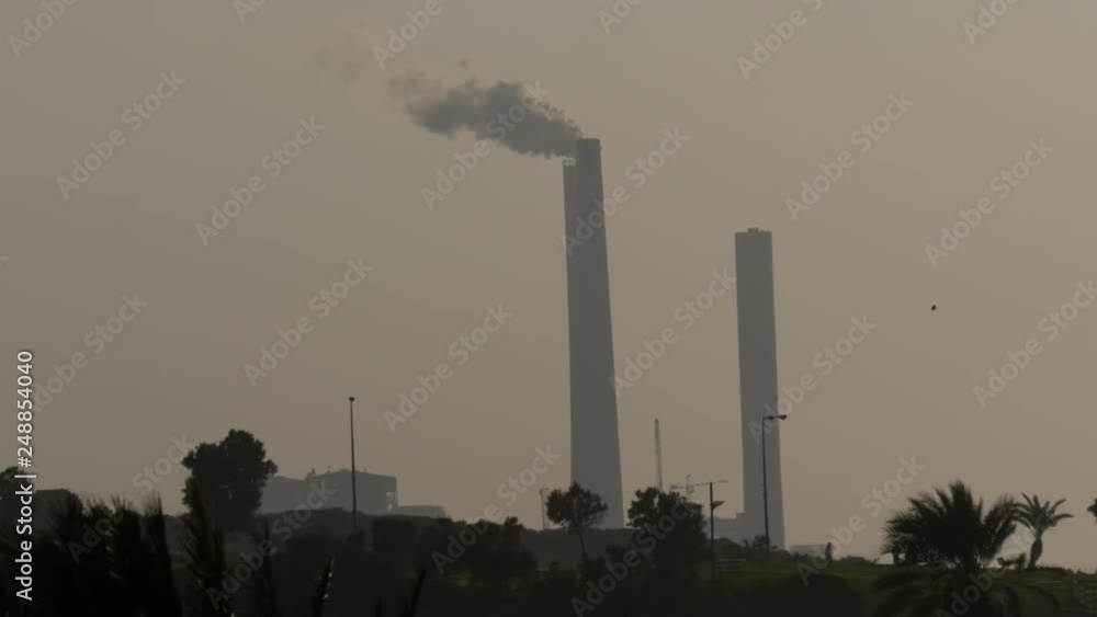 Panorama with plant tubes fumes, view from the park Panorama with plant tubes fumes, view from the park