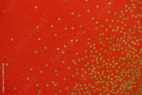 gold dots on red background