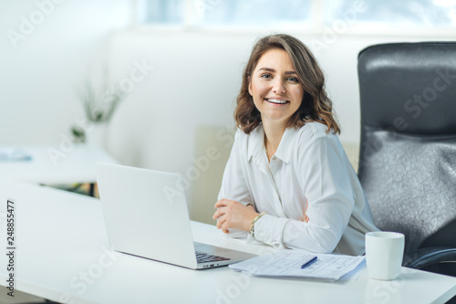 Young woman in office working photo