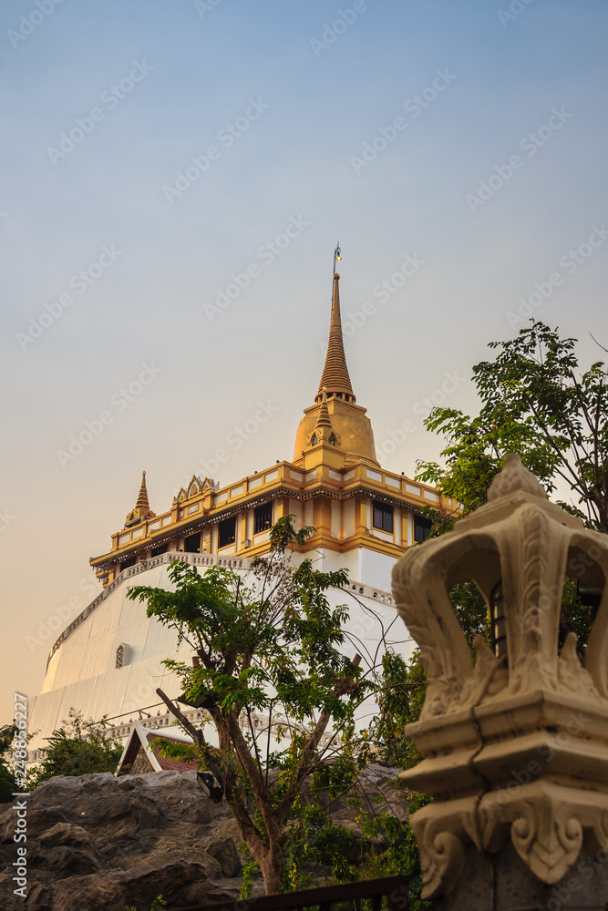 Fototapeta premium Beautiful view of Wat Saket Ratcha Wora Maha Wihan (Wat Phu Khao Thong, Golden Mount temple), a popular Bangkok tourist attraction and has become one of the symbols of the city.