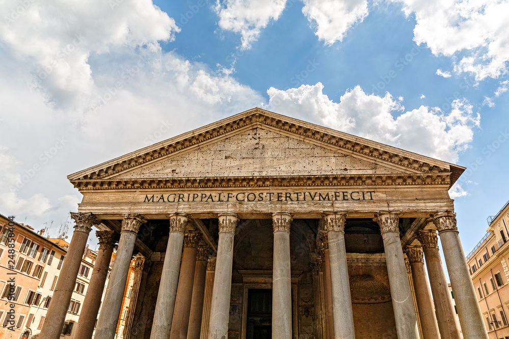 Italy Europe ancient roman pantheon temple front view at classical columns portico colonnade with surrounding historic rome buildings 