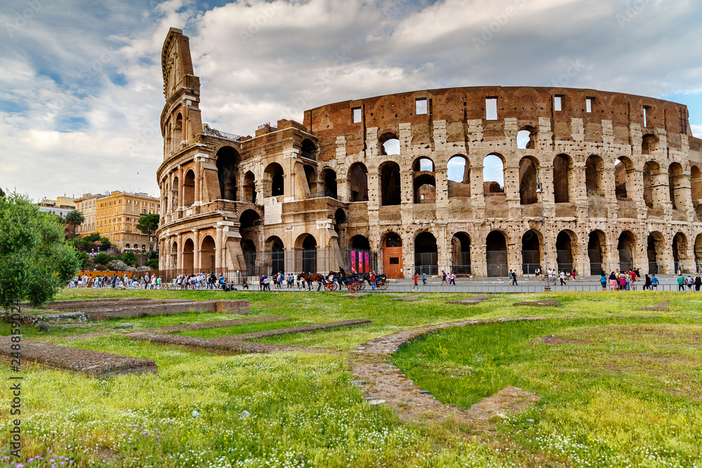 Rome/ Italy July 2018: Colosseum in Rome, Italy. Ancient Roman Colosseum is one of the main tourist attractions in Europe. Scenic view of Colosseum ruins in summer.