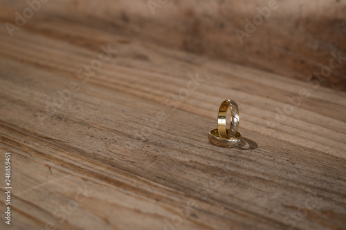 Wallpaper Mural golden rings on wooden background Torontodigital.ca