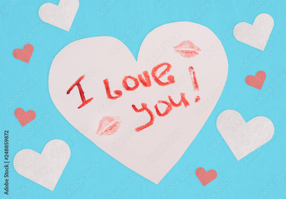 Postcard with an inscription I love you. Lipstick text. Love note