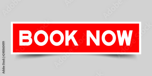 Square red color sticker with word book now on gray background