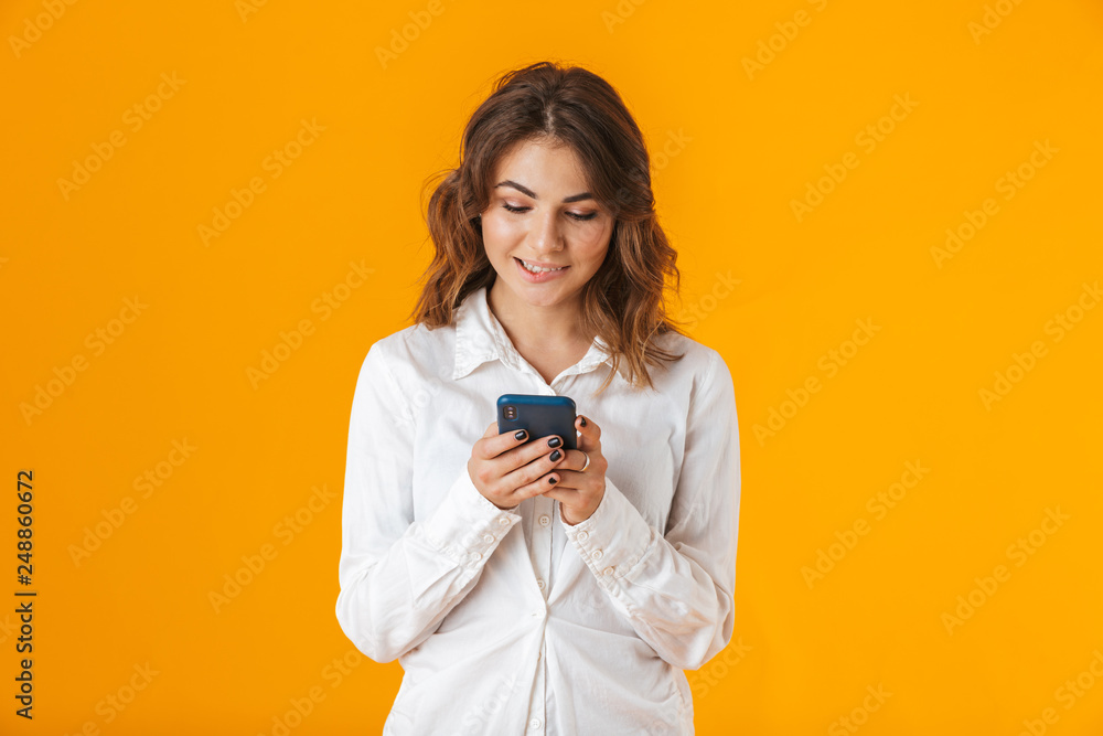Portrait of a cheerful young woman wearing white shirt Portrait of a cheerful young woman wearing white shirt