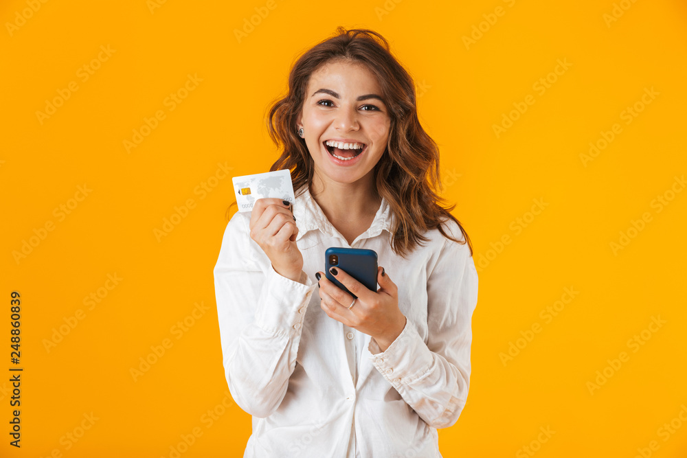 Portrait of a cheerful young woman wearing white shirt Portrait of a cheerful young woman wearing white shirt