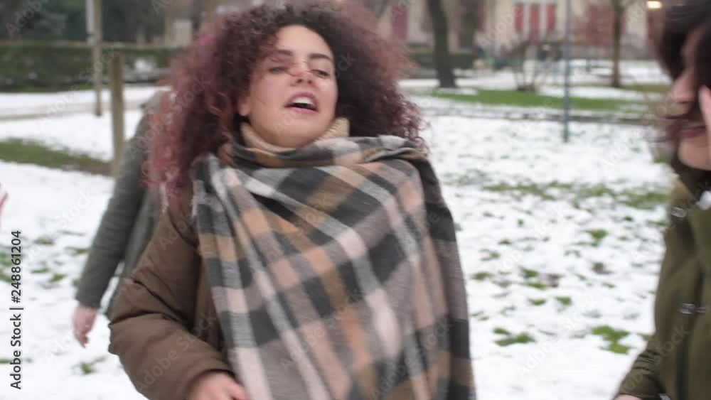 slow motion five young women multiethnic outdoor snow field having fun dancing - happiness, friendship, positive emotions concept slow motion five young women multiethnic outdoor snow field having fun dancing - happiness, friendship, positive emotions concept