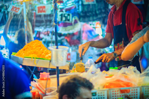 Photography Close up hand of vendor during cooking for Padthai, the original Thai Fried Nood