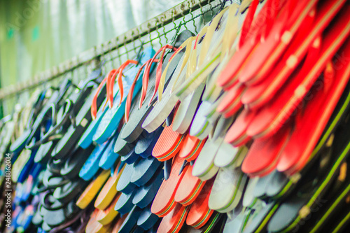 Colorful flip flop sandals in store at Khao San Road night market, Bangkok, Thailand.