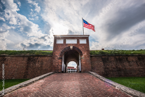 Historic American flying over the entrance to Fort McHenry National Monument, Baltimore, Maryland