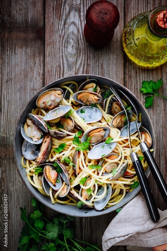 Traditional italian seafood pasta with clams Spaghetti alle Vongole in the pan