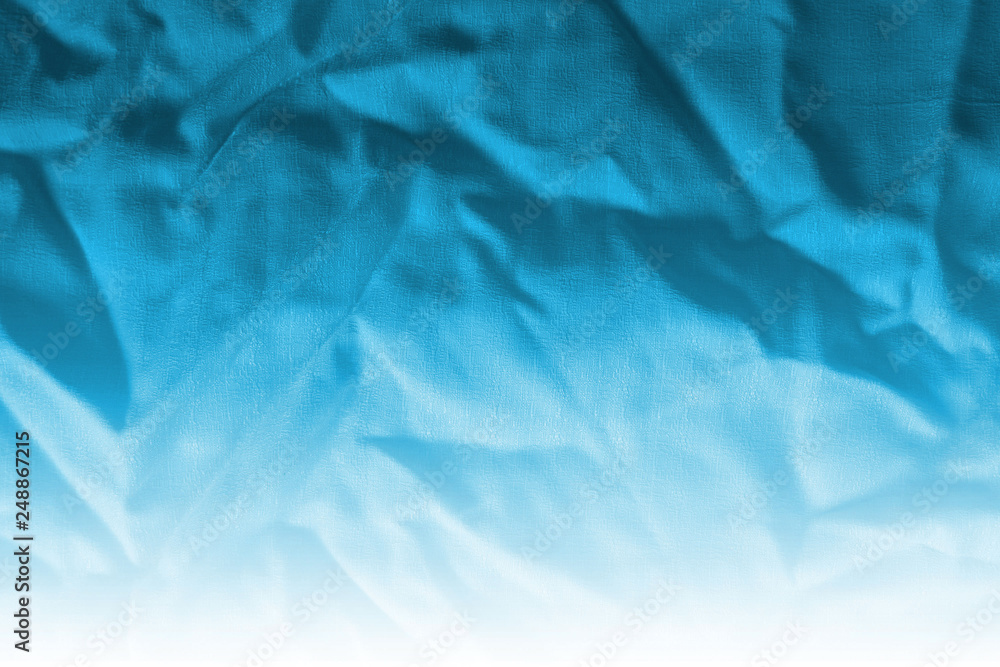 Obraz premium Ocean blue textile background. Silk cloth texture. Fabric pattern.