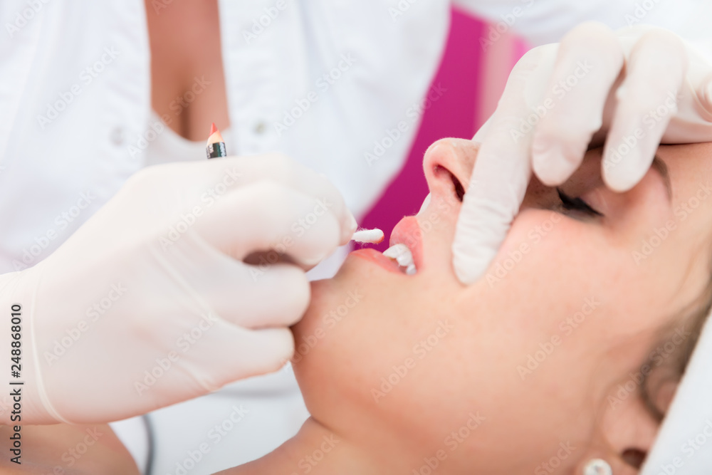 Woman undergoing lips treatment Woman undergoing lips treatment