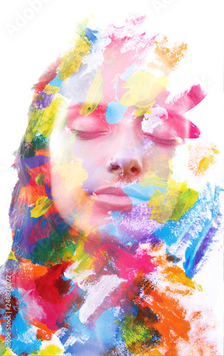 Paintography. Double exposure. Close up of an attractive peaceful model combined with colorful hand drawn acryllic paintings with overlapping brushstroke texture photo