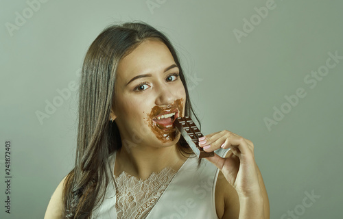 woman with blindfold sexy eating chocolate