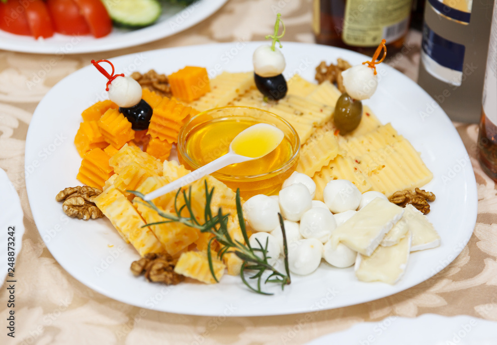 Cheese plate with honey and nuts