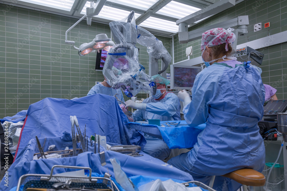 brain surgery in operation room with digital microscope Stock Photo