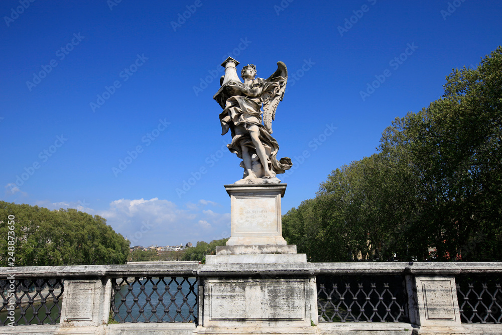 Statue on the Saint Angelo bridge over the Tiber river in Rome, Italy