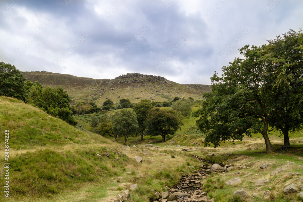  Rural landscape with steep limestone valleys at the Peak District National Park is in central England. 