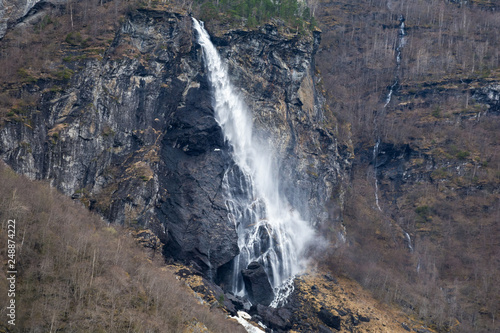 view of the dark rocks and waterfall. severe northern nature. Norwegian landscape