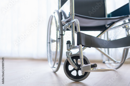 Wheelchair in medical office. © amornchaijj