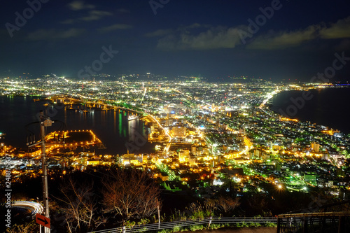 Hakodate City view in the night sky with many colorful city lights from Mountain Hakodate, Autumn season, Hokkaido, Japan.