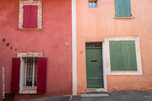Colourful houses in the village of Rousillon, France photo