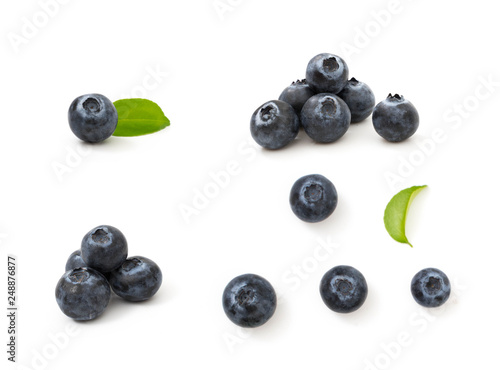 Group blueberries and leaf isolated on white