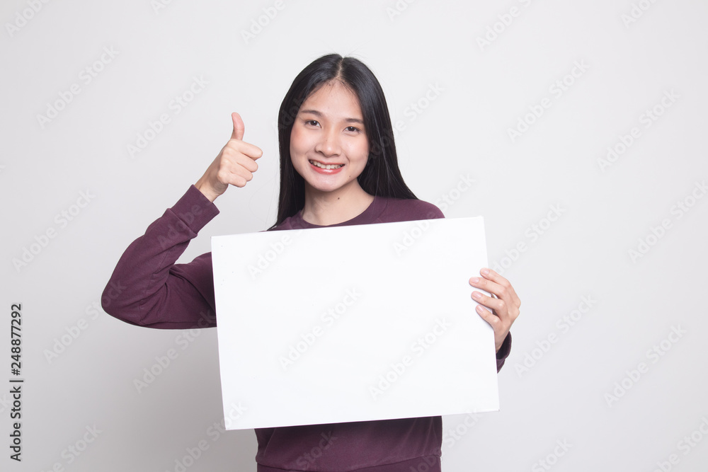 Young Asian woman show thumbs up with white blank sign. Young Asian woman show thumbs up with white blank sign.