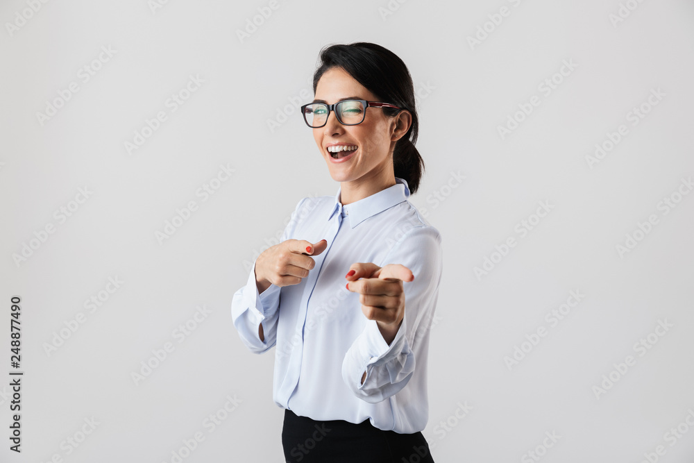 Image of pretty secretary woman 30s wearing eyeglasses standing in the office, isolated over white background Image of pretty secretary woman 30s wearing eyeglasses standing in the office, isolated over white background