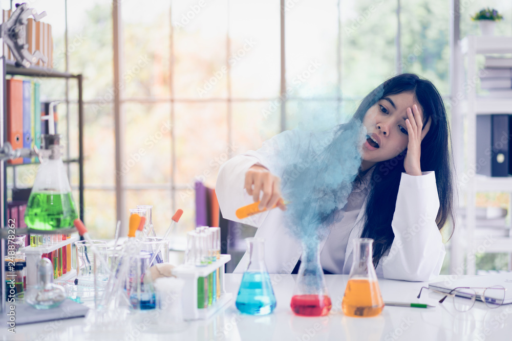 Portrait of Asian scientist is shocking in the science room. Portrait of Asian scientist is shocking in the science room.