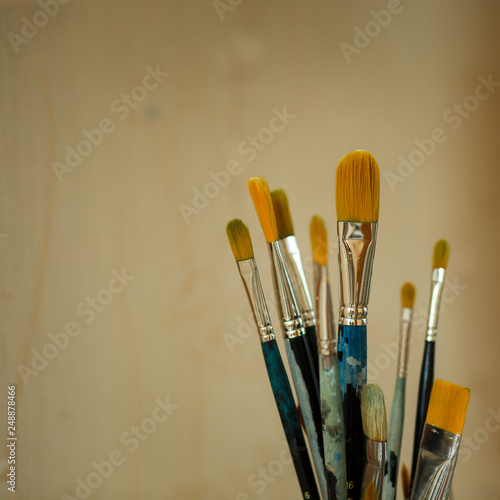  Paint brushes in the paint are in the bank