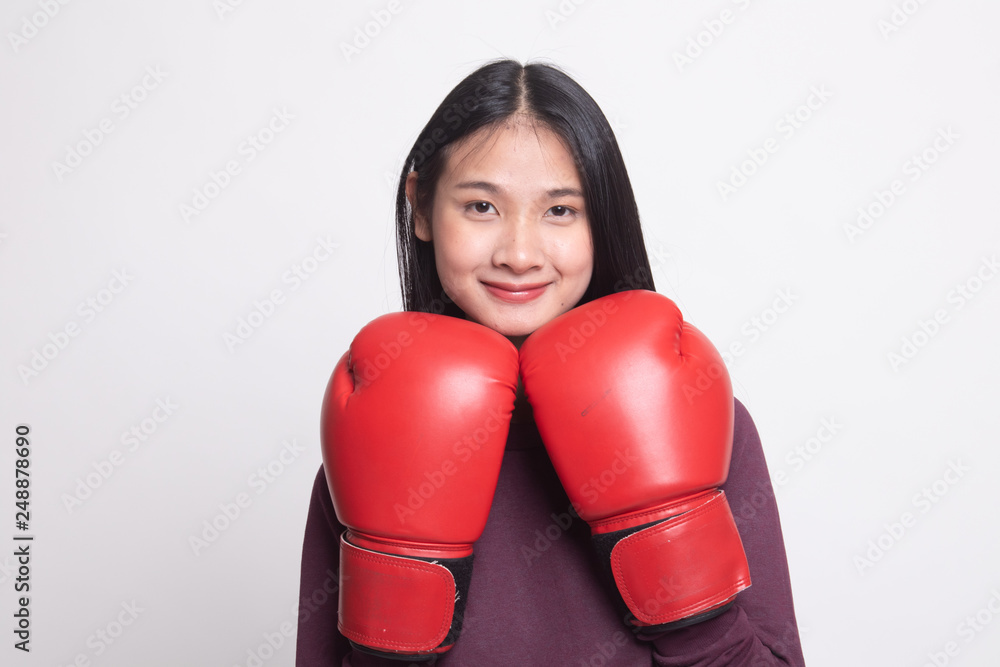 Young Asian woman with red boxing gloves. Young Asian woman with red boxing gloves.