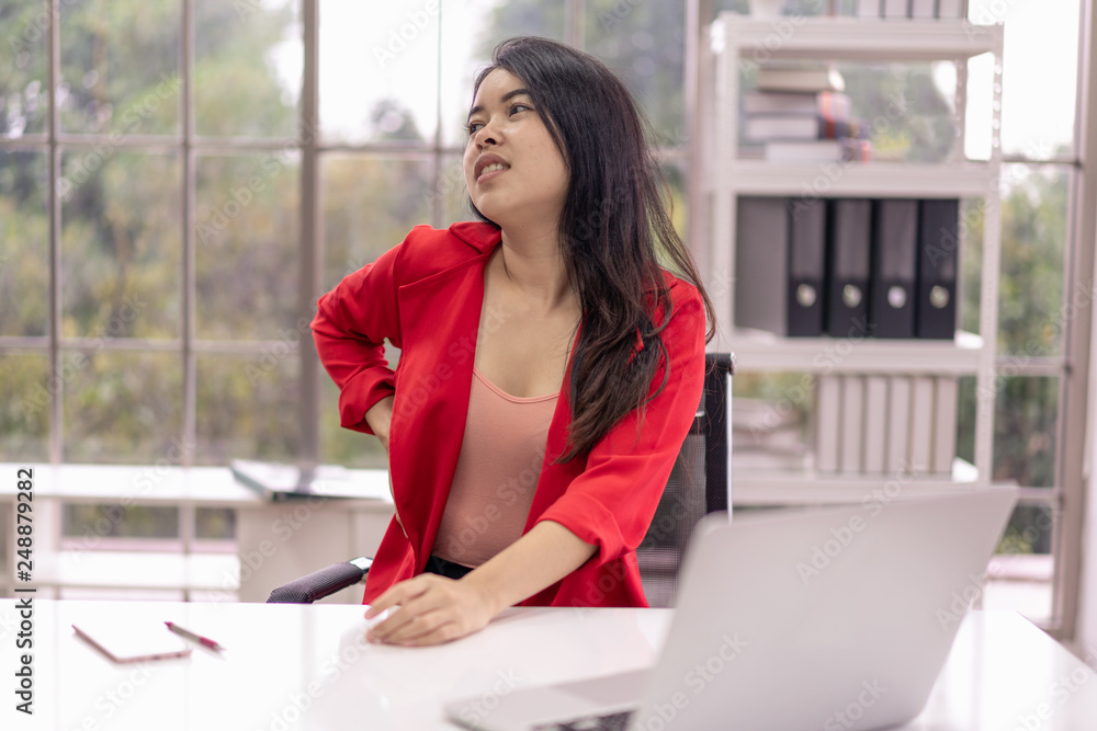 Business woman have back pain caused by working in the office. Office Syndrome. Business woman have back pain caused by working in the office. Office Syndrome.