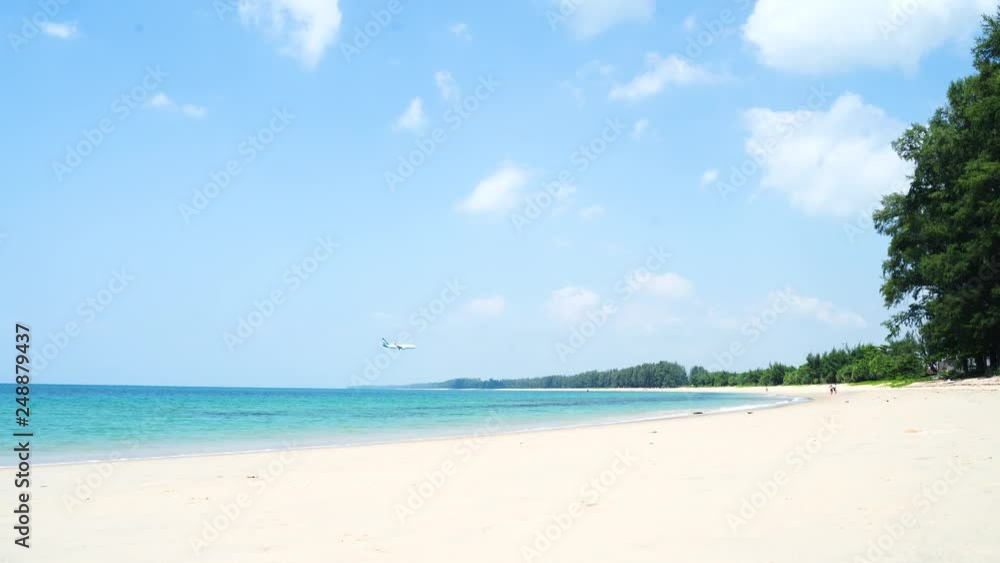 Tropical beach afternoon view, of the plane is down near the airport. tropical white sand beach. Sea waves seamless loop on the beautiful sand beach,Phuket Thailand. Tropical beach afternoon view, of the plane is down near the airport. tropical white sand beach. Sea waves seamless loop on the beautiful sand beach,Phuket Thailand.