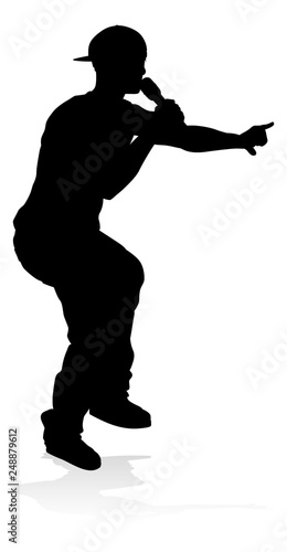 A singer pop, country music, rock star or hiphop rapper artist vocalist singing in silhouette