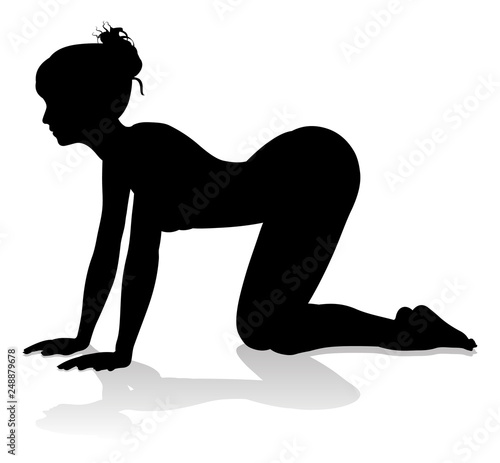 A silhouette of a woman in a yoga or pilates pose 