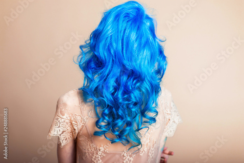 blue hair hairstyle curls girl's back bright hair color creative painting in a bright shade colorist work summer style